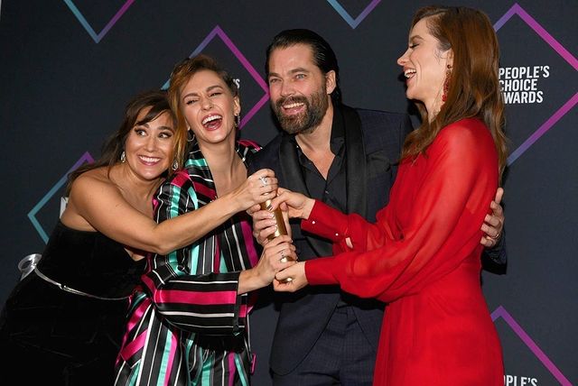 Tim Rozon's with co-actor while receiving award