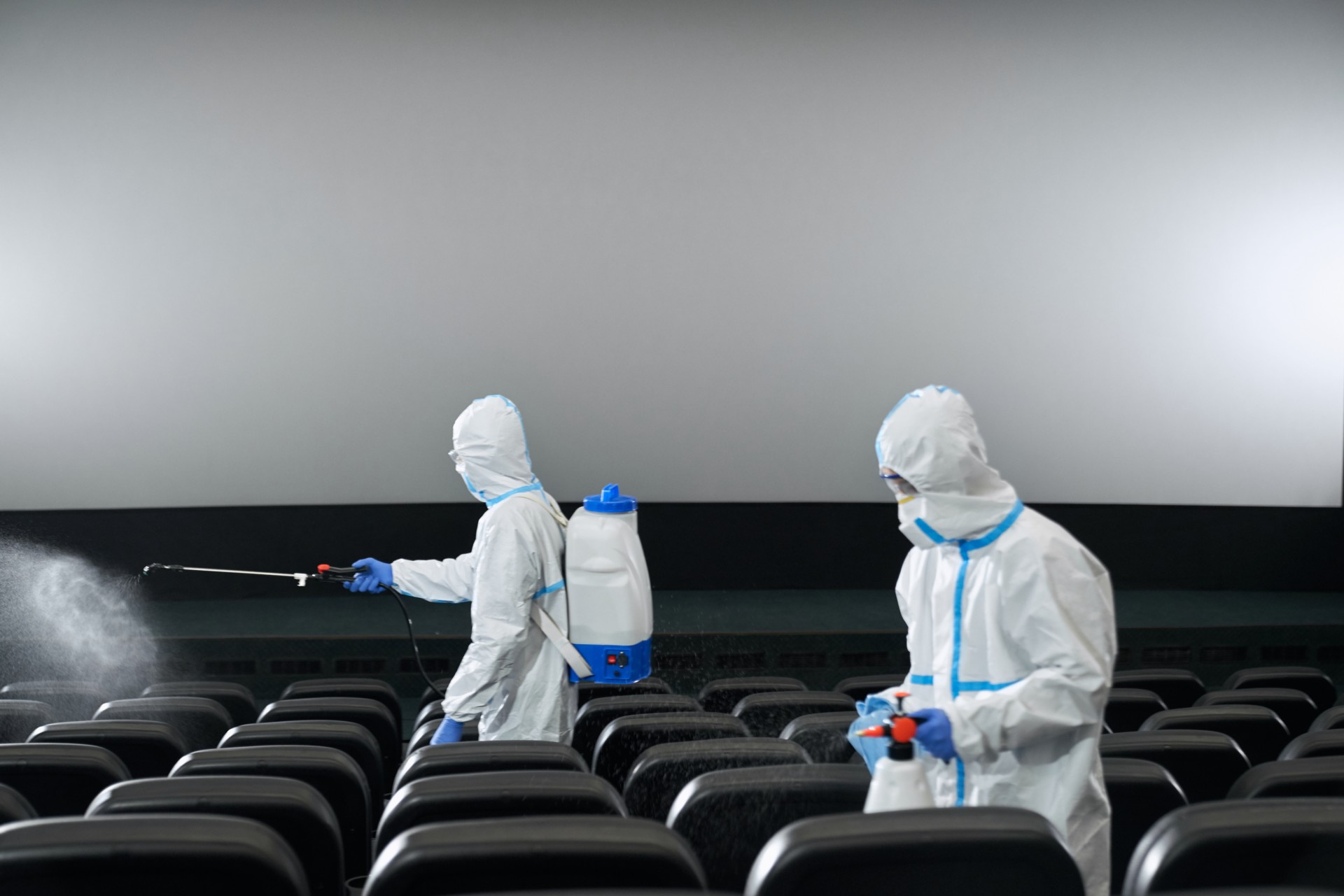 workers cleaning cinema hall with disinfectants 2022 02 03 11 18 56 utc