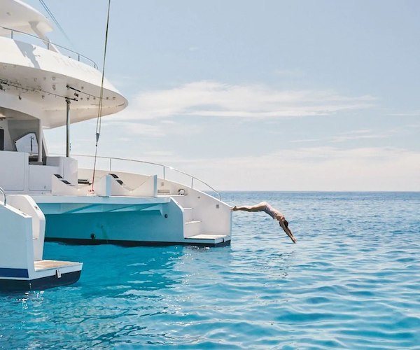 jumping into the water off the yacht