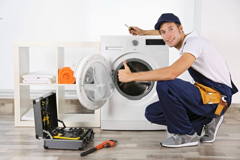 plumber repairing washing machine