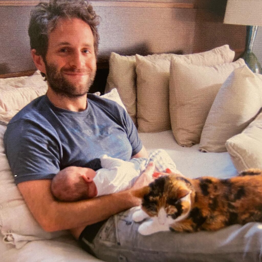 Glenn Howerton with his child