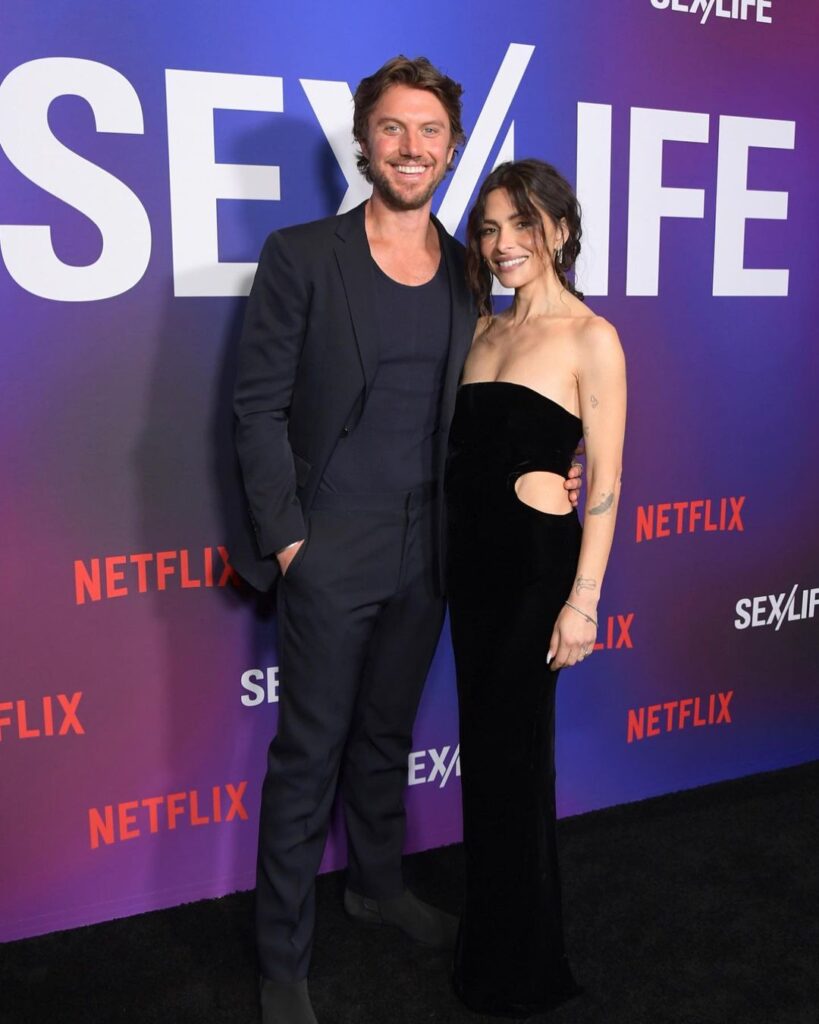 Adam Demos with his girlfriend