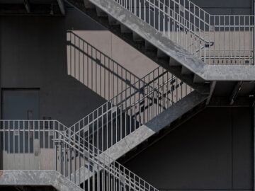 Enhancing Aesthetics and Safety: The Allure of Metal Stairs and Railings in Apartment Buildings