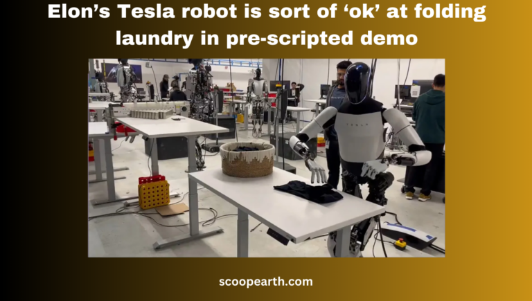 This time, Elon Musk's humanoid Tesla robot, Optimus, performs additional tasks. It's folding a t-shirt on a table inside a development facility.